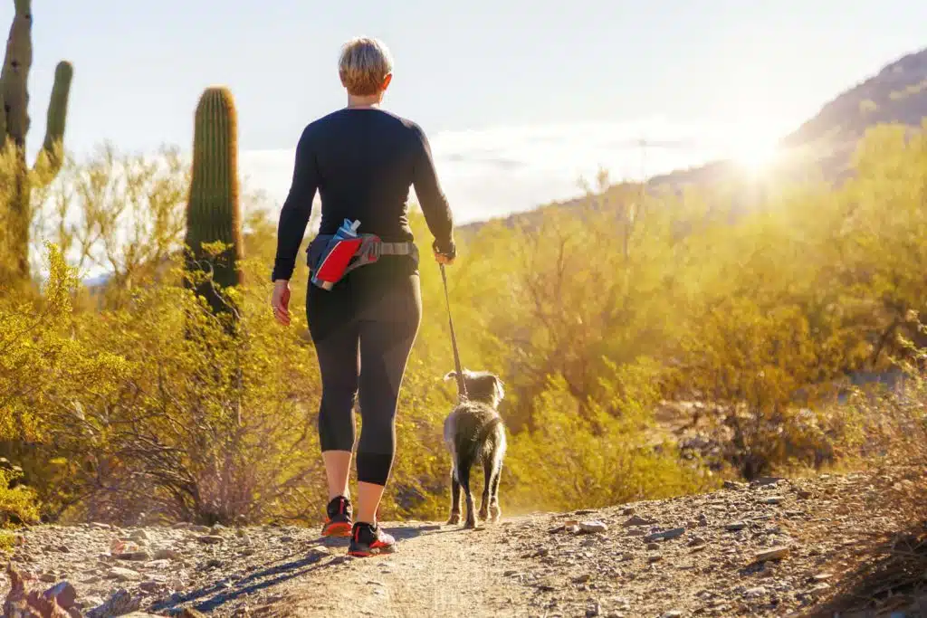 Woman Hiking With Dog in Phoenix Arizona near Sevilla Sol Mobile Homes For Sale Peoria AZ